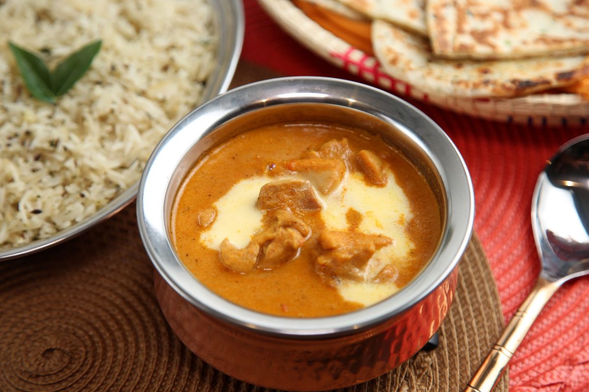 A bowl of Butter Chicken Masala in a rich tomato-cream sauce