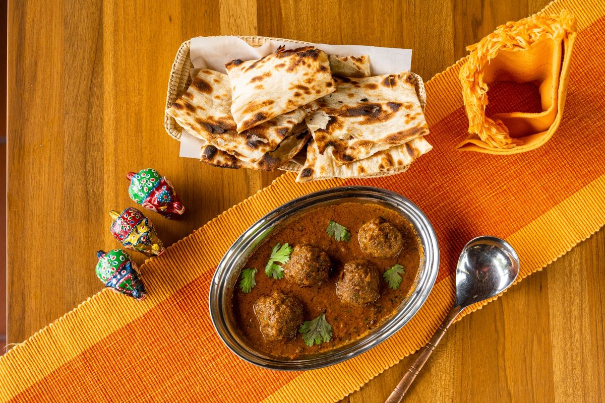 Mutton kofta curry served with fresh naan